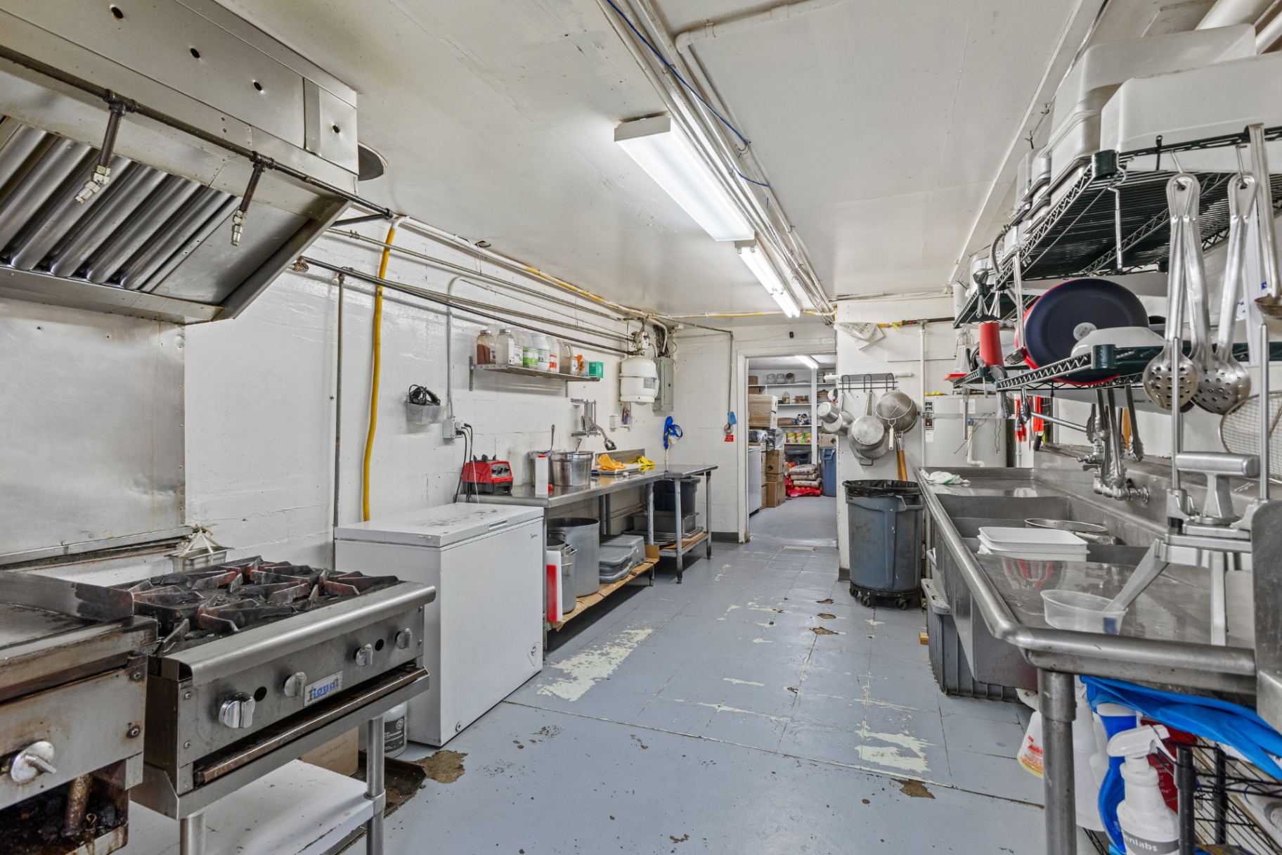 Commercial kitchen with hood and stove